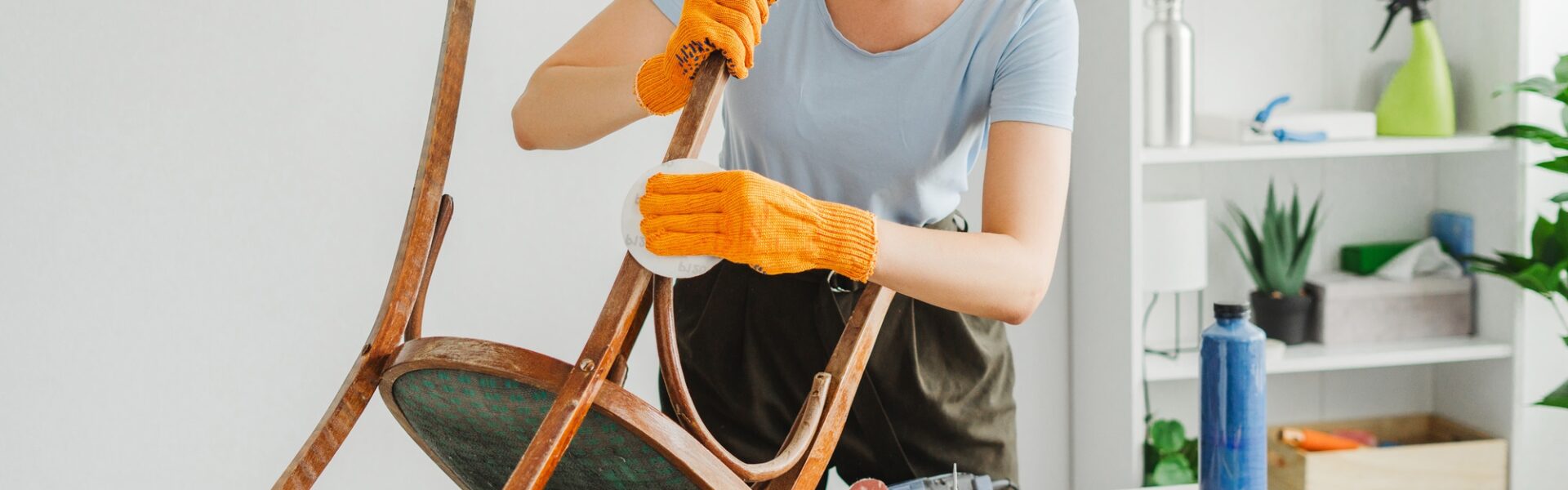 woman-restoring-furniture-using-sandpaper-in-workshop.jpg