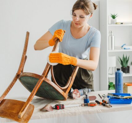 woman-restoring-furniture-using-sandpaper-in-workshop.jpg