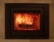 Energy fireplace on a wall, fire flames and burning wood logs in a stove